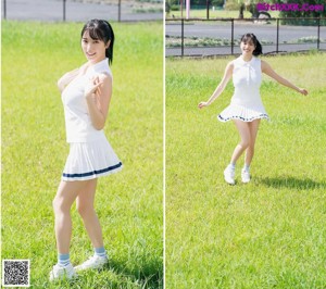 A woman in a white dress sitting on a tennis court.