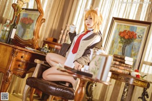 A woman sitting on a chair in a room.