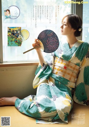 A woman in a kimono on the cover of a magazine.