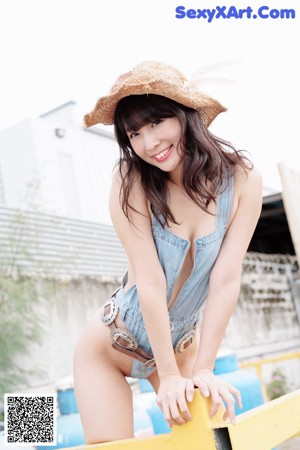 A woman in a bathing suit on the cover of a magazine.
